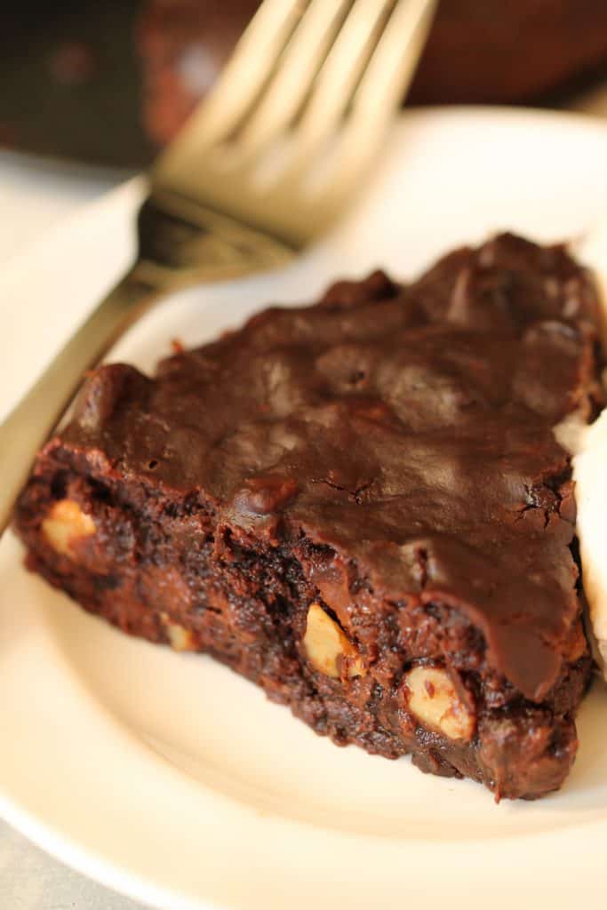 Instant Pot Fudgy Brownie on a plate with a fork.