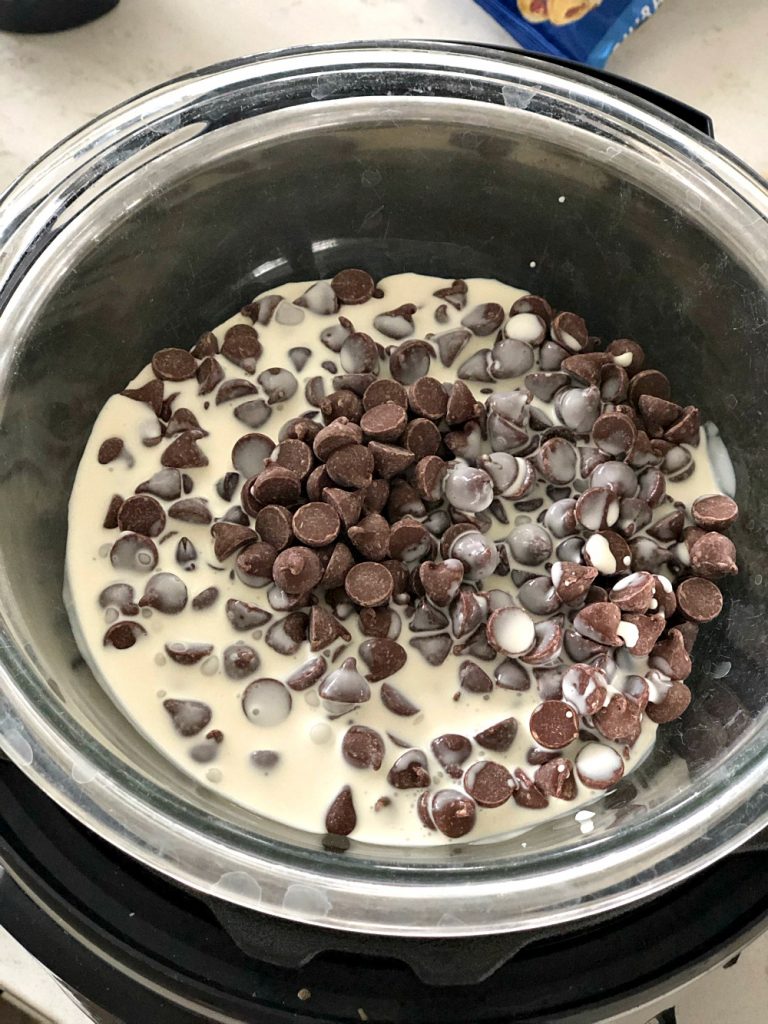 Chocolate Chips and heavy cream in glass bowl