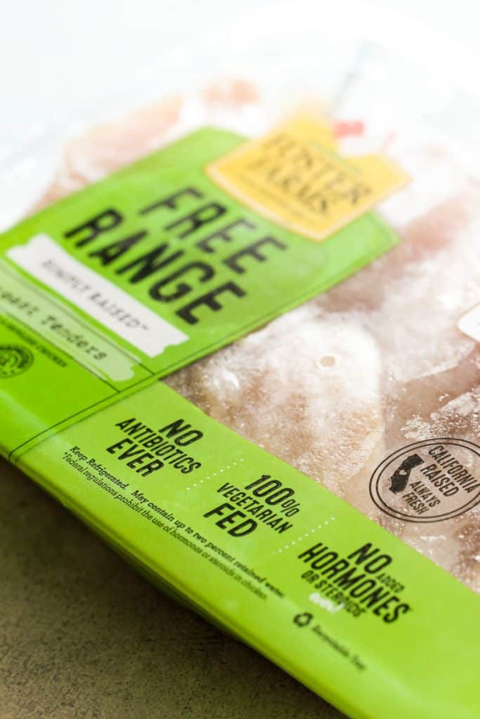 Frozen chicken breast in package.