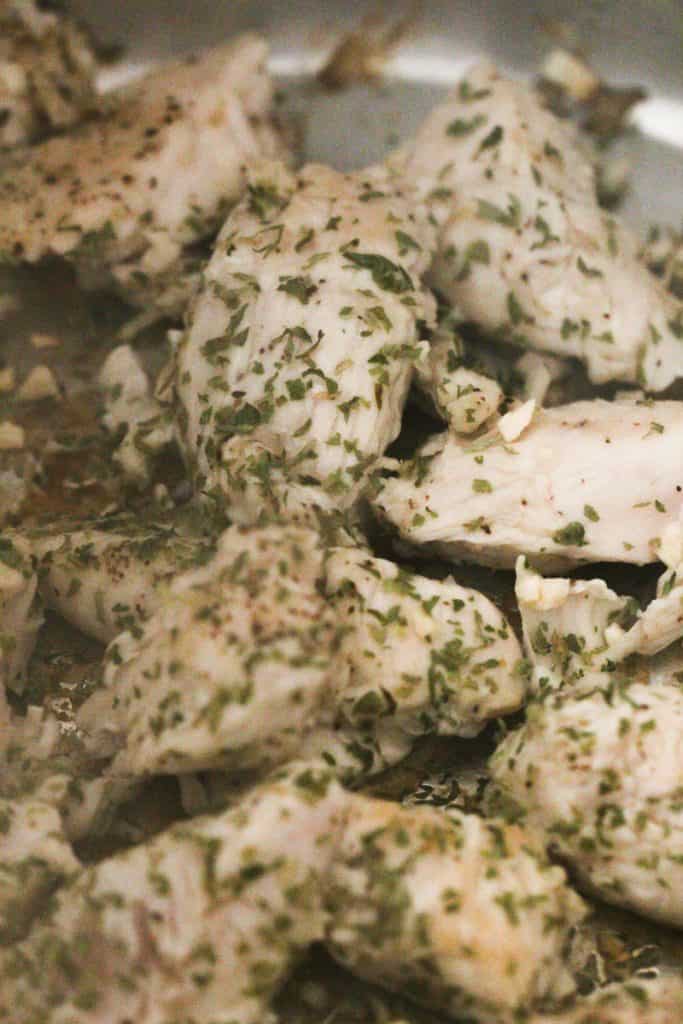 Chicken breast cooked and seasoned.