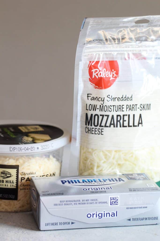 Shredded mozzarella cheese, cream cheese and parmesan cheese.