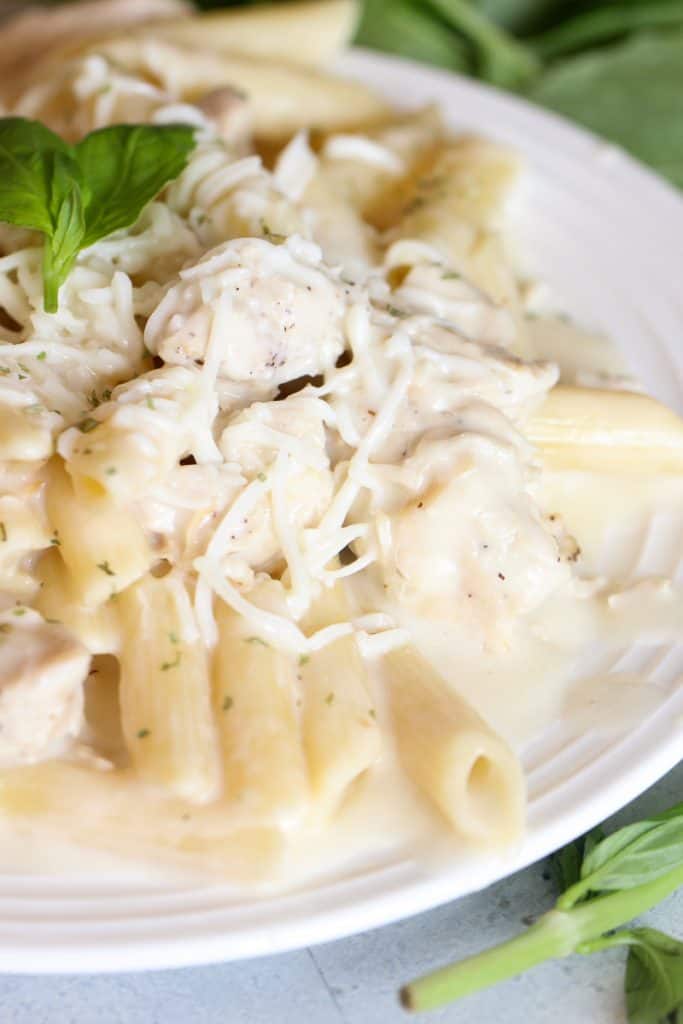 Close up of Instant Pot Chicken Alfredo Penne Pasta on a plate.
