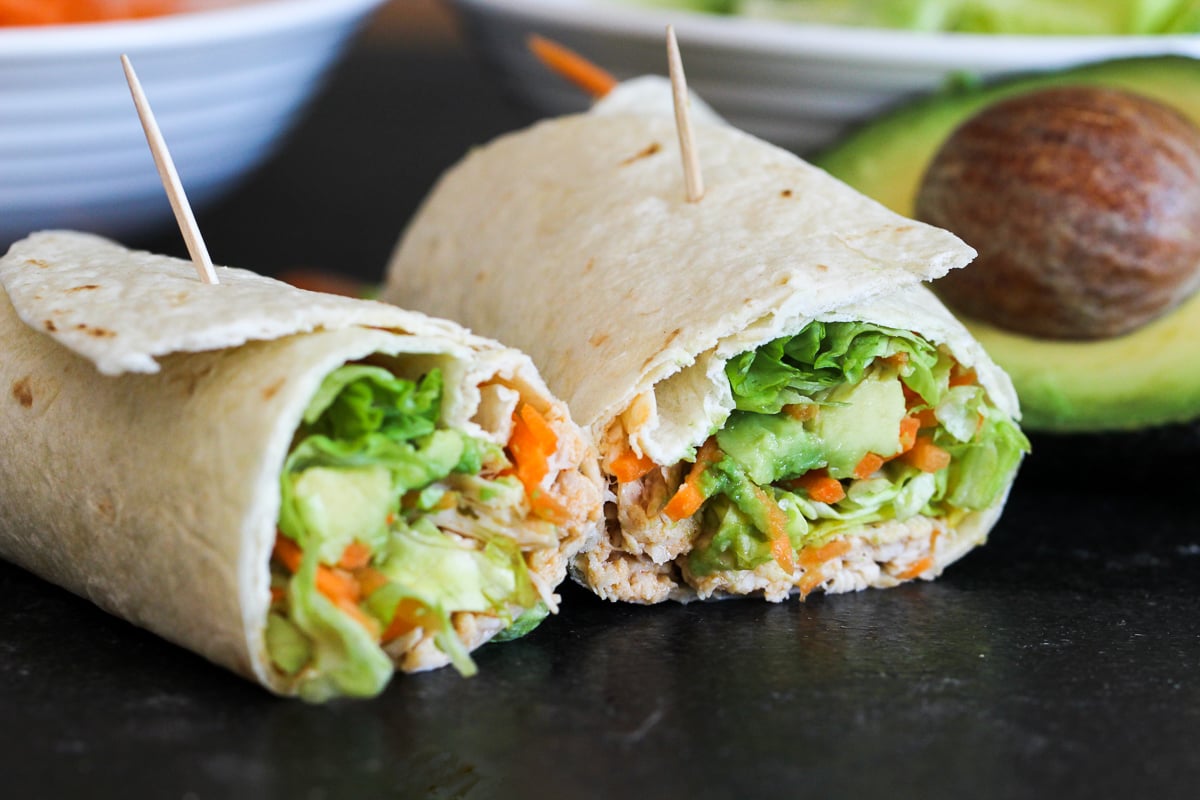 Instant Pot Buffalo Chicken Wraps cut in half with a toothpick in it