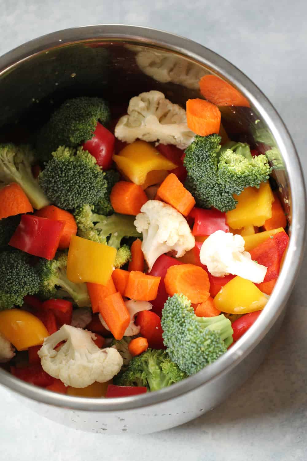 fresh raw vegetables in an instant pot liner ready to be cooked