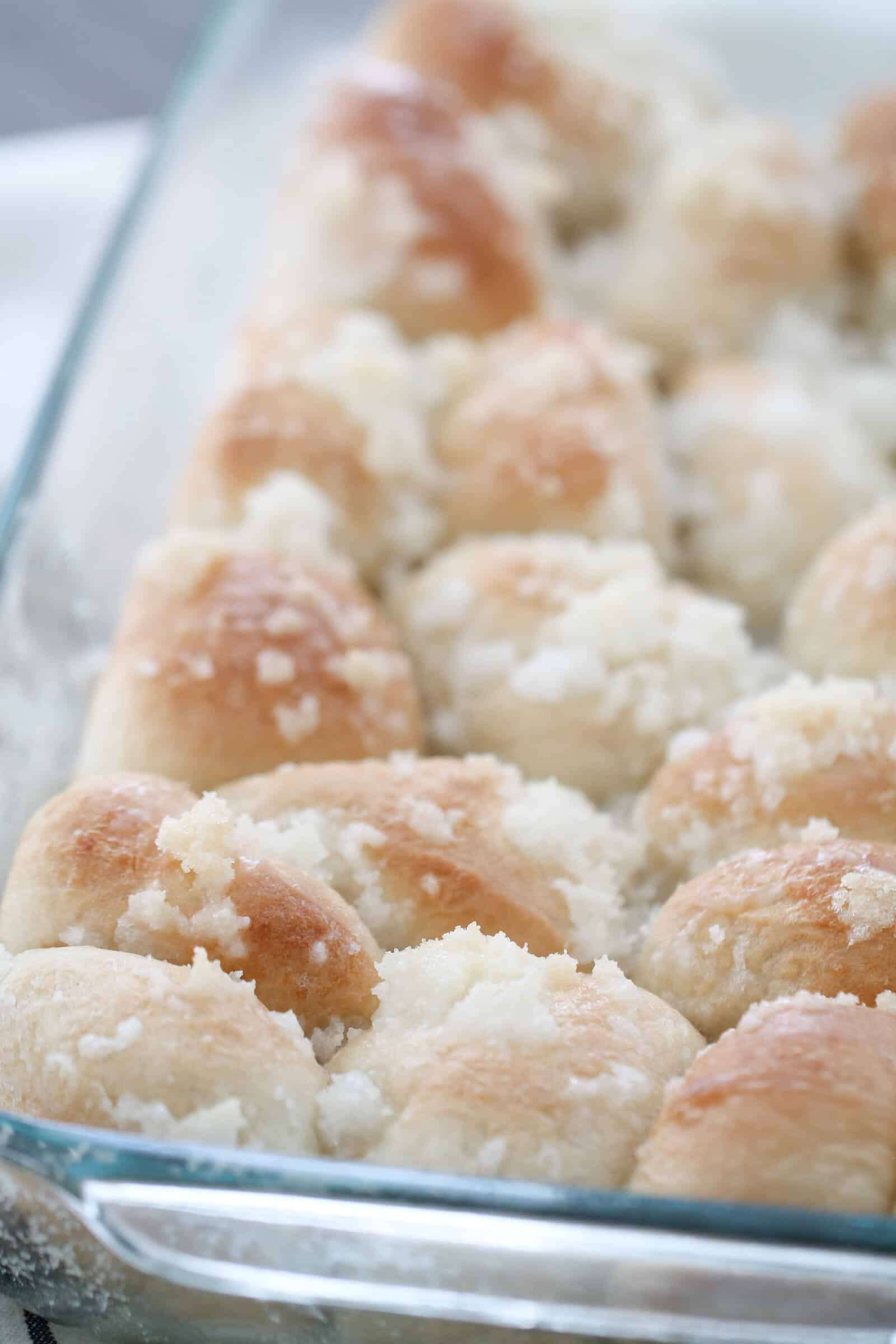 Close up of unbaked risen Easy Lemon Monkey Bread in a baking dish