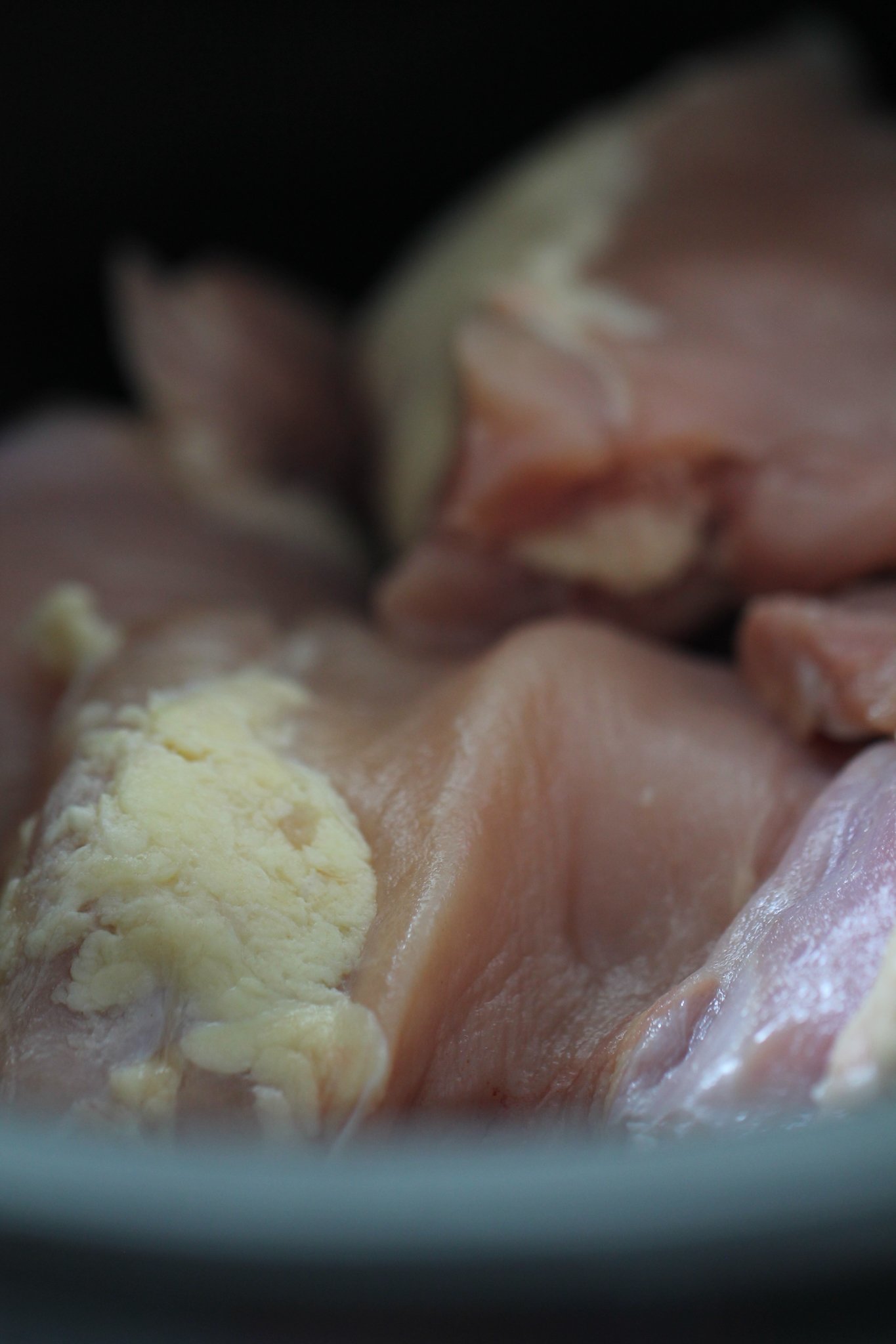 Raw chicken breast in the slow cooker