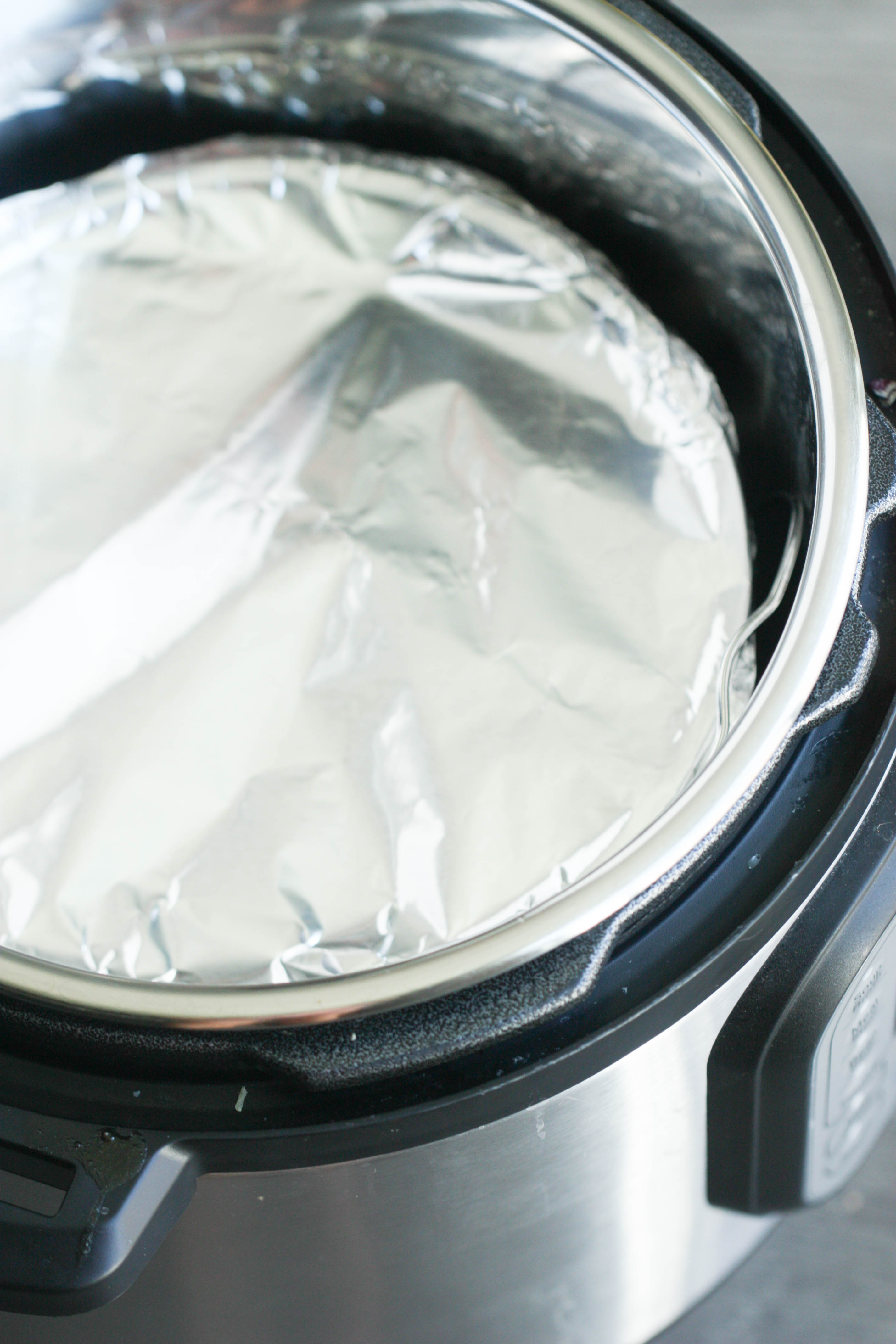Instant pot with cake pan, covered with foil