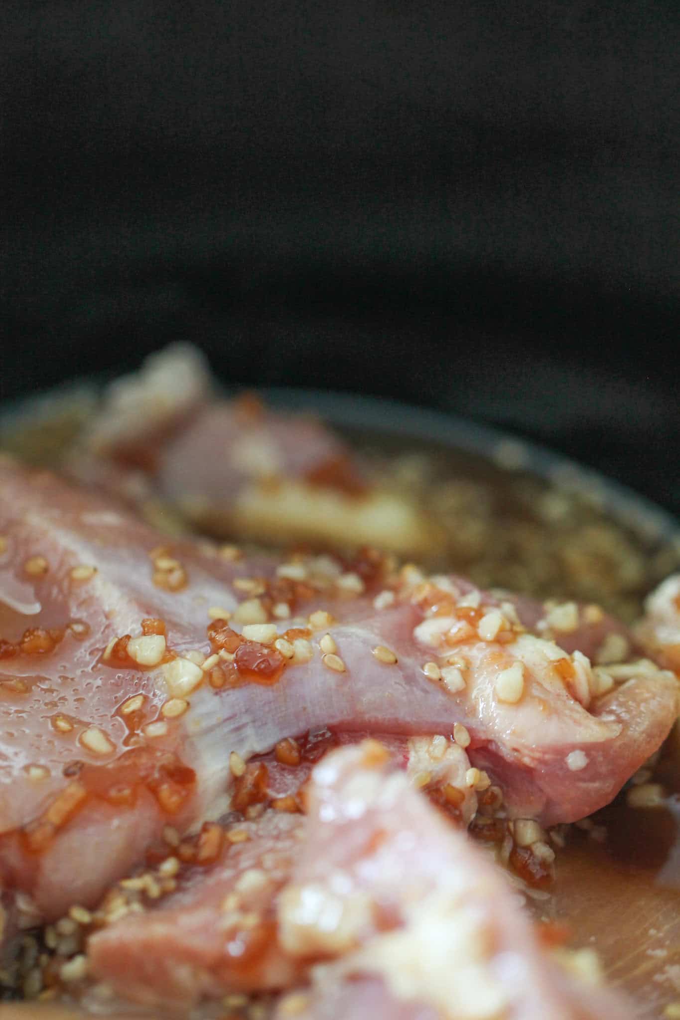 Sauce on top of raw chicken in the slow cooker