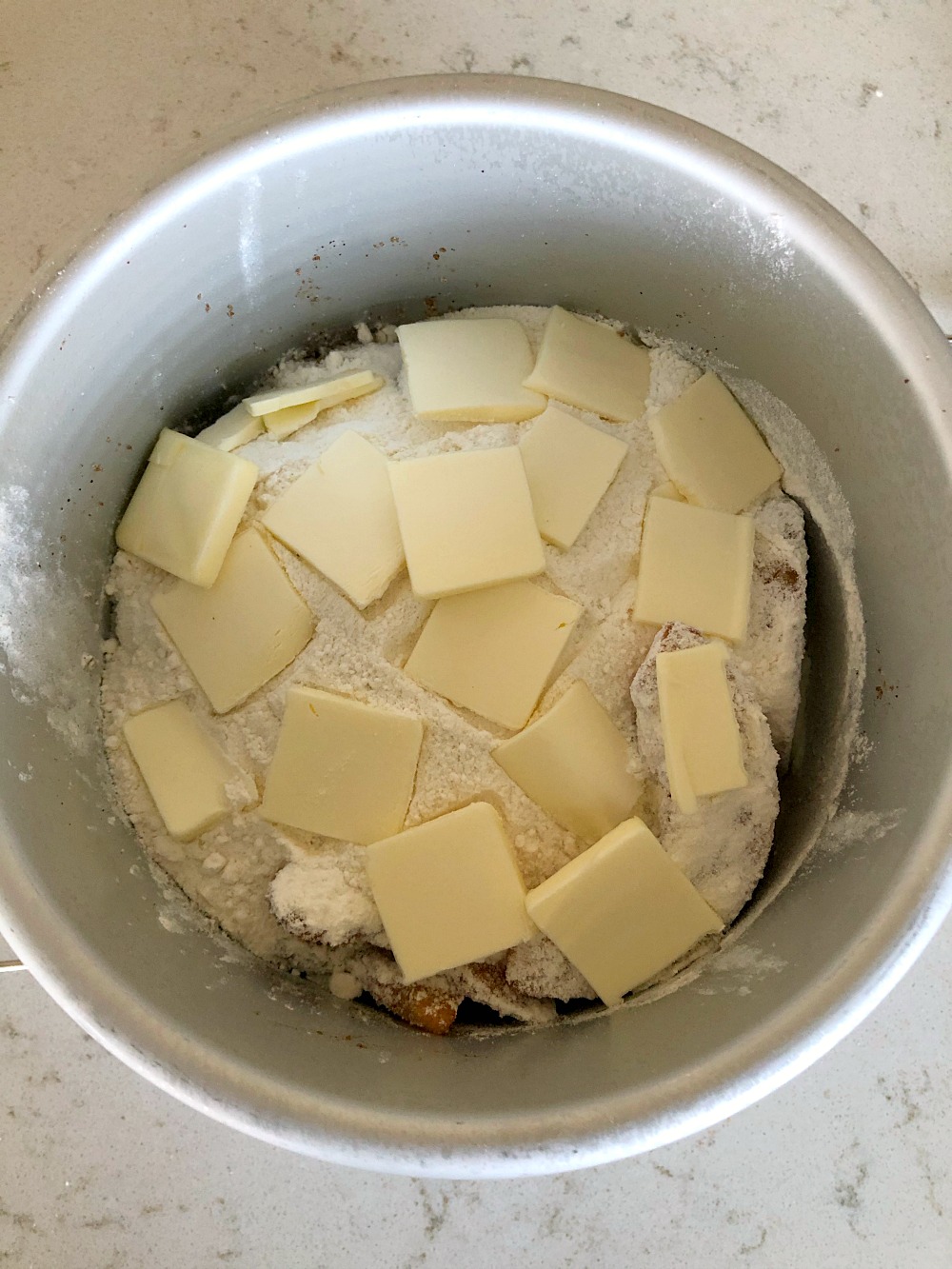 Sliced butter on top of all ingredients in Instant Po