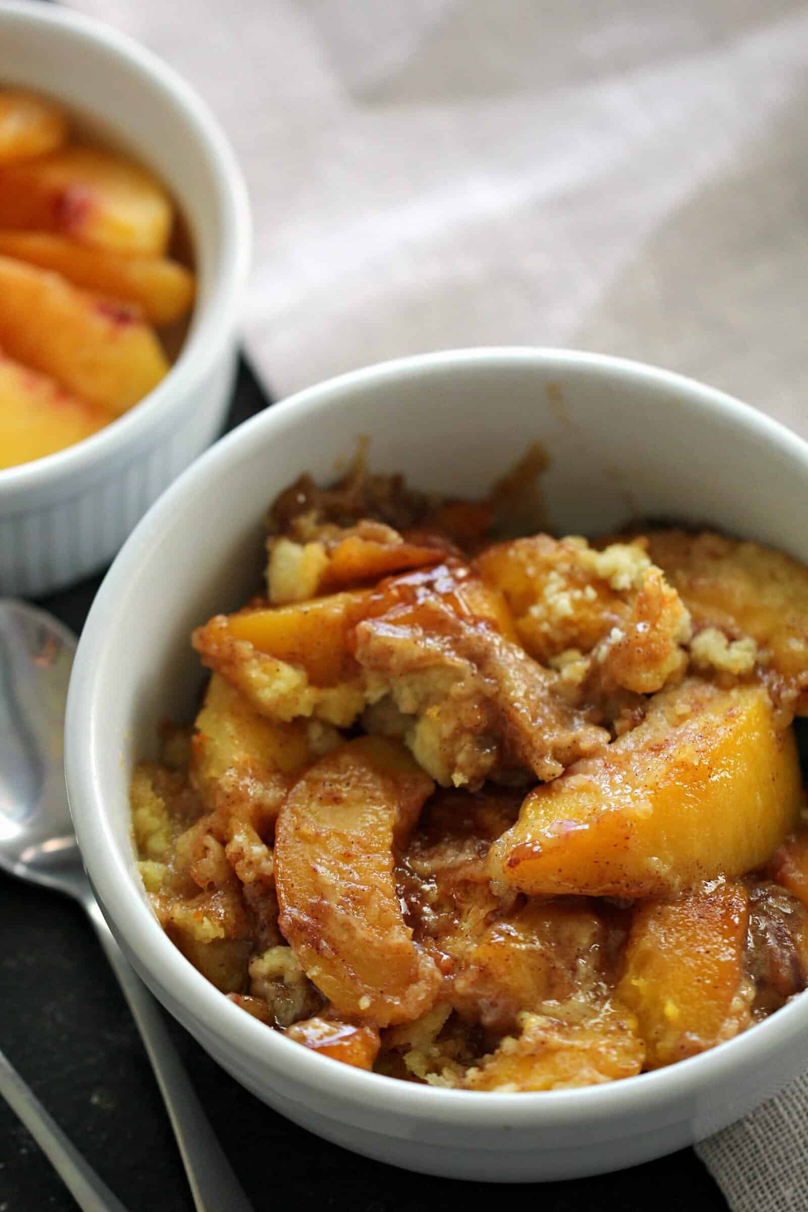 Easy Instant Pot Peach Cobbler in a white bowl