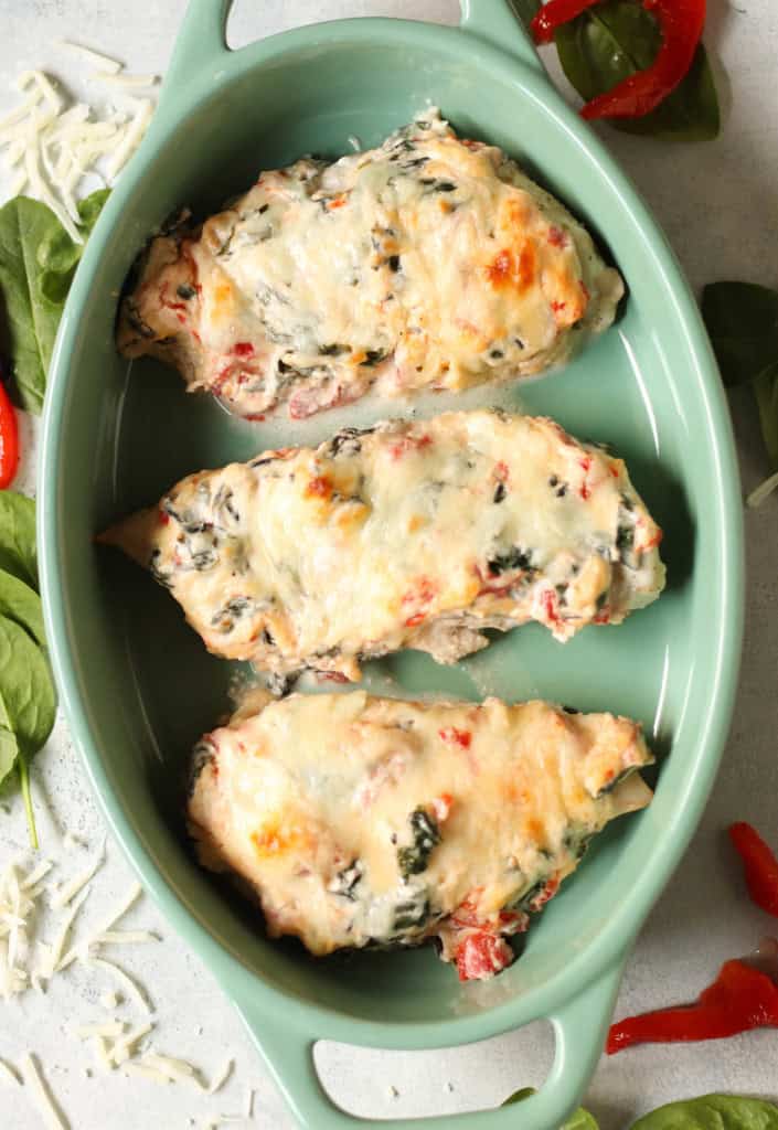 baked roasted red pepper chicken in a casserole dish