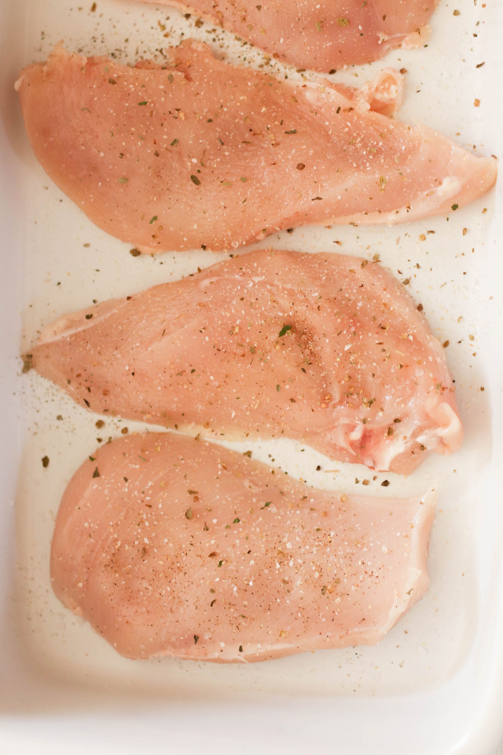 boneless, skinless chicken breasts seasoned with salt, pepper, garlic salt, and Italian seasoning