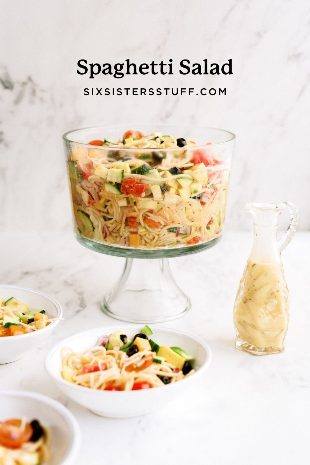 spaghetti salad in glass bowl with homemade dressing