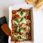 Easy pesto chicken in ceramic baking dish.