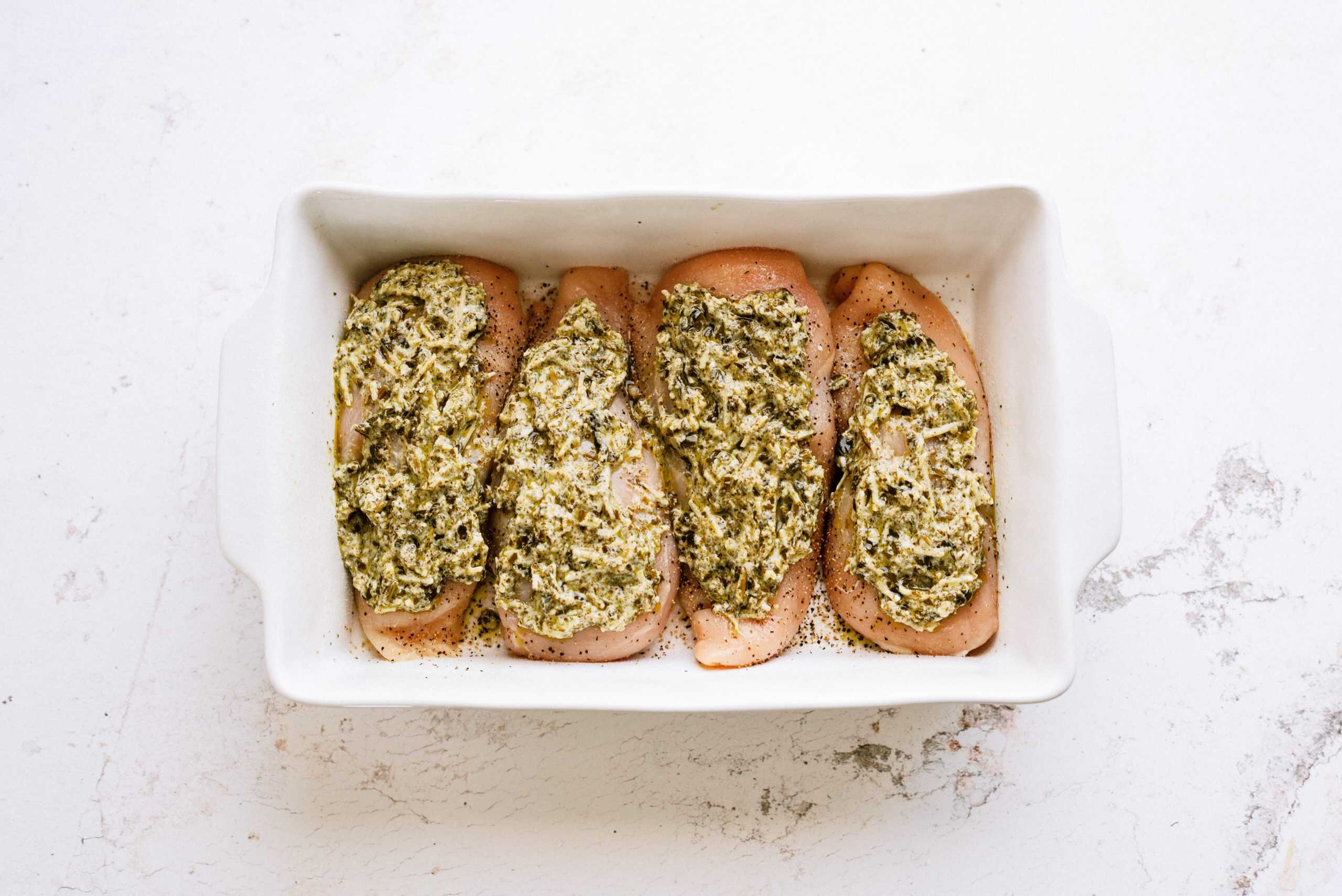 Easy Pesto Chicken Bake in pan ready to go in the oven