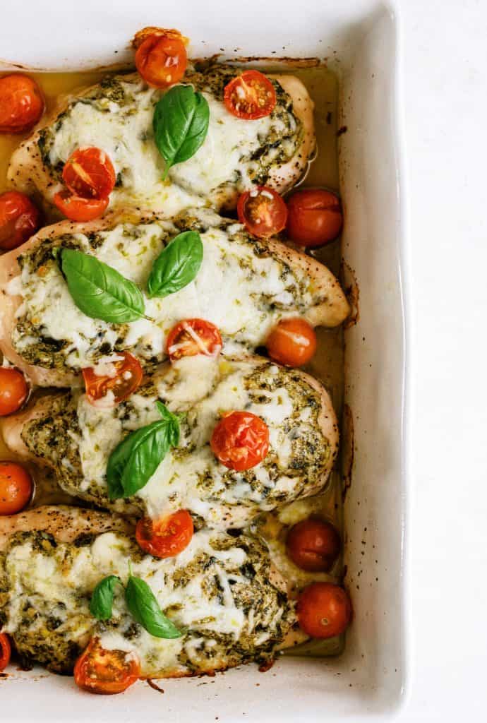 Easy Pesto Chicken in a white baking dish.
