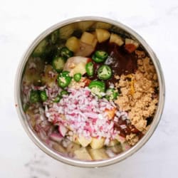 all the hawaiian bbq chicken taco ingredients in the inner pot of the instant pot