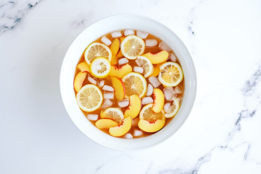 A large punch bowl filled with Sparkling Peach Punch