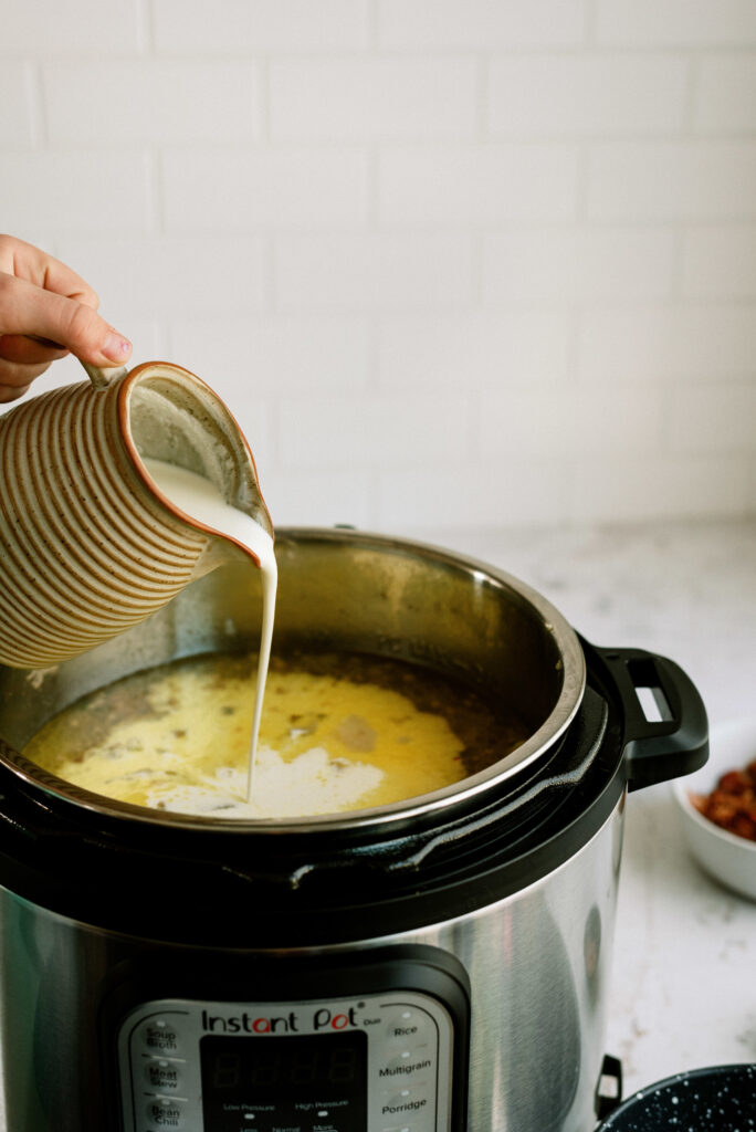Pouring the heavy cream into the Instant Pot