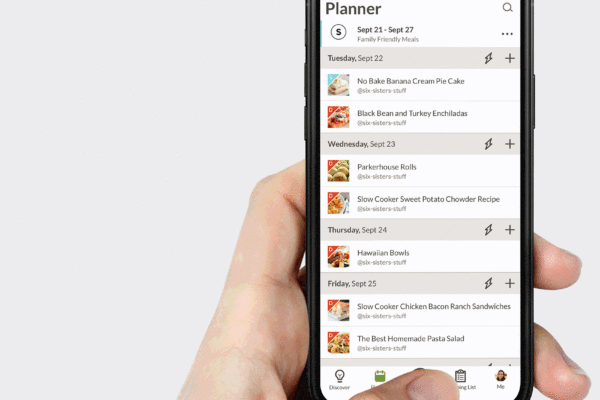 hand holding a phone that displays how to use the Prepear app for meal planning and grocery shopping