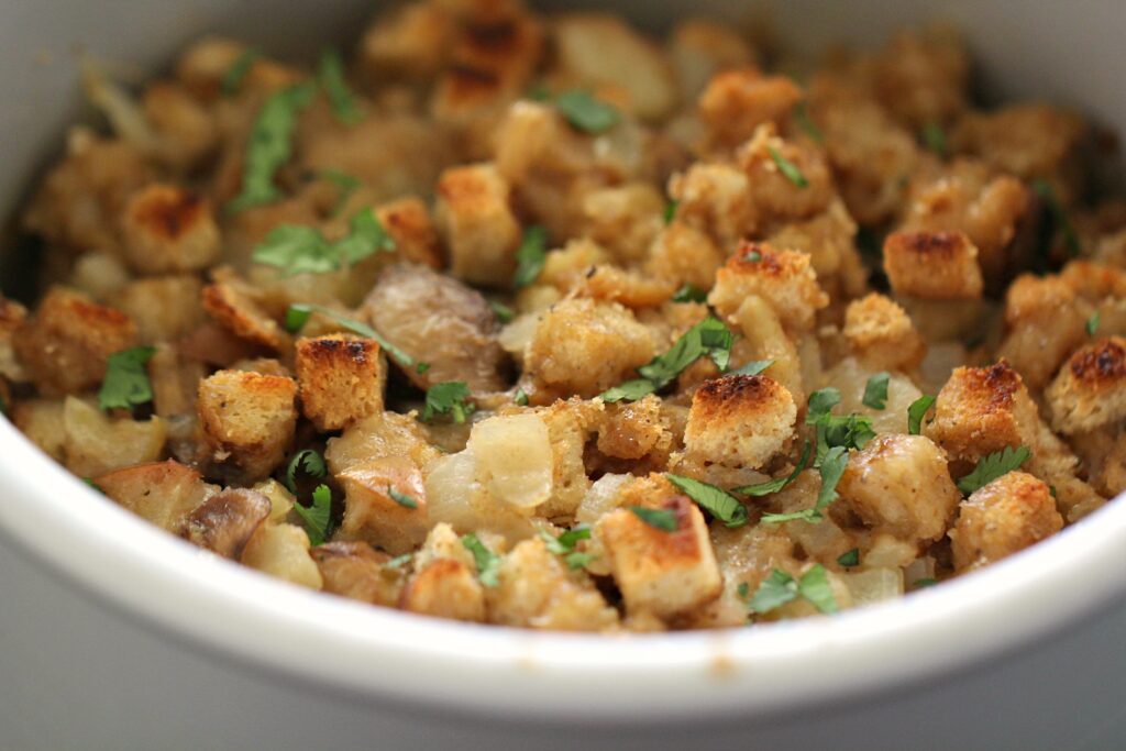 stuffing cooked in an instant pot topped with fresh green parsley