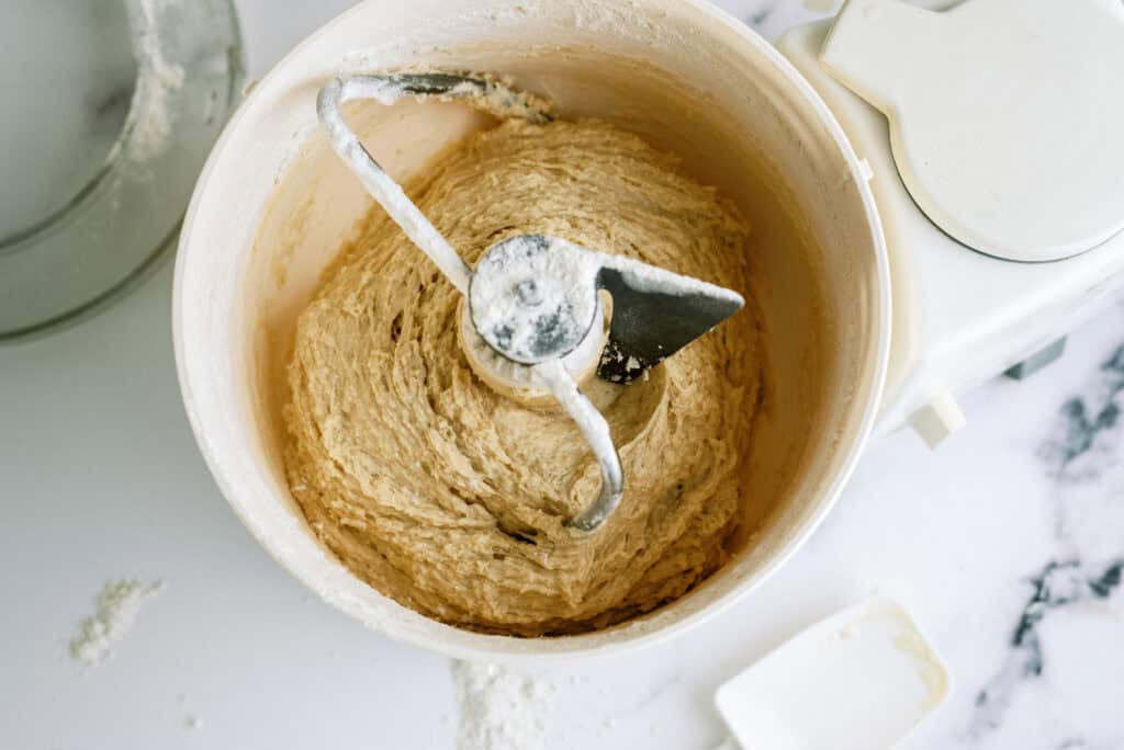 Lion House roll dough in a stand mixer bowl.