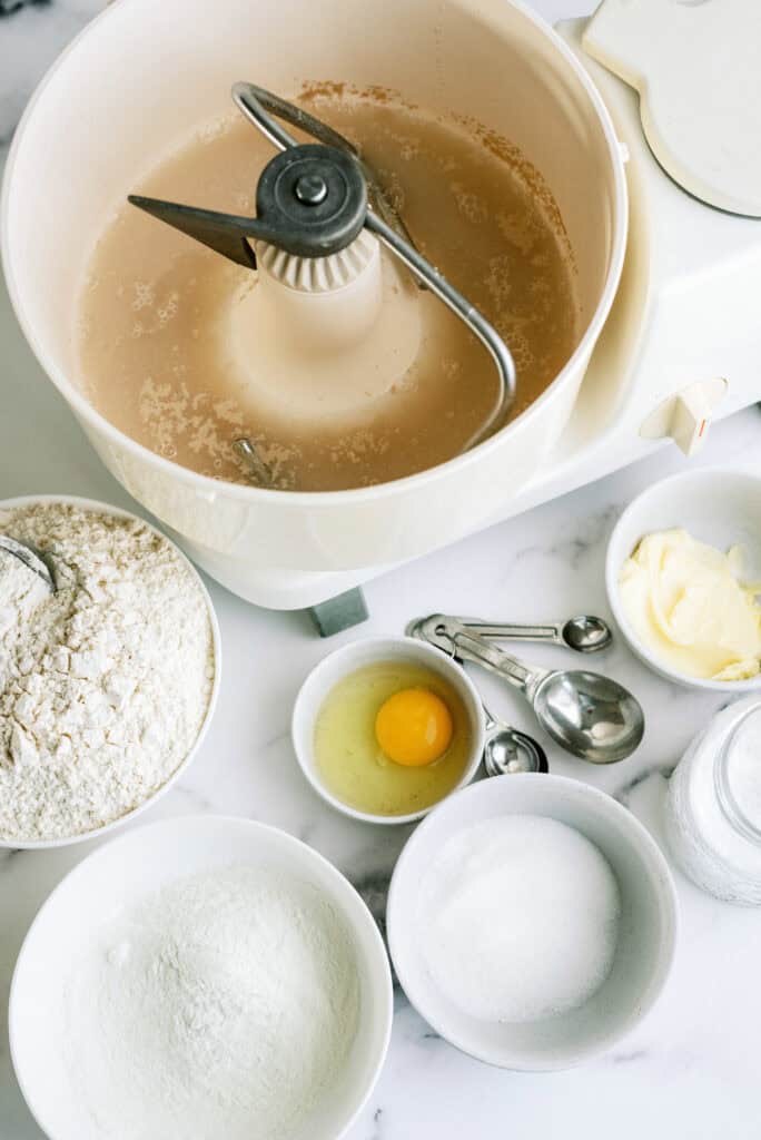 Dissolve yeast into water in a mixing bowl.