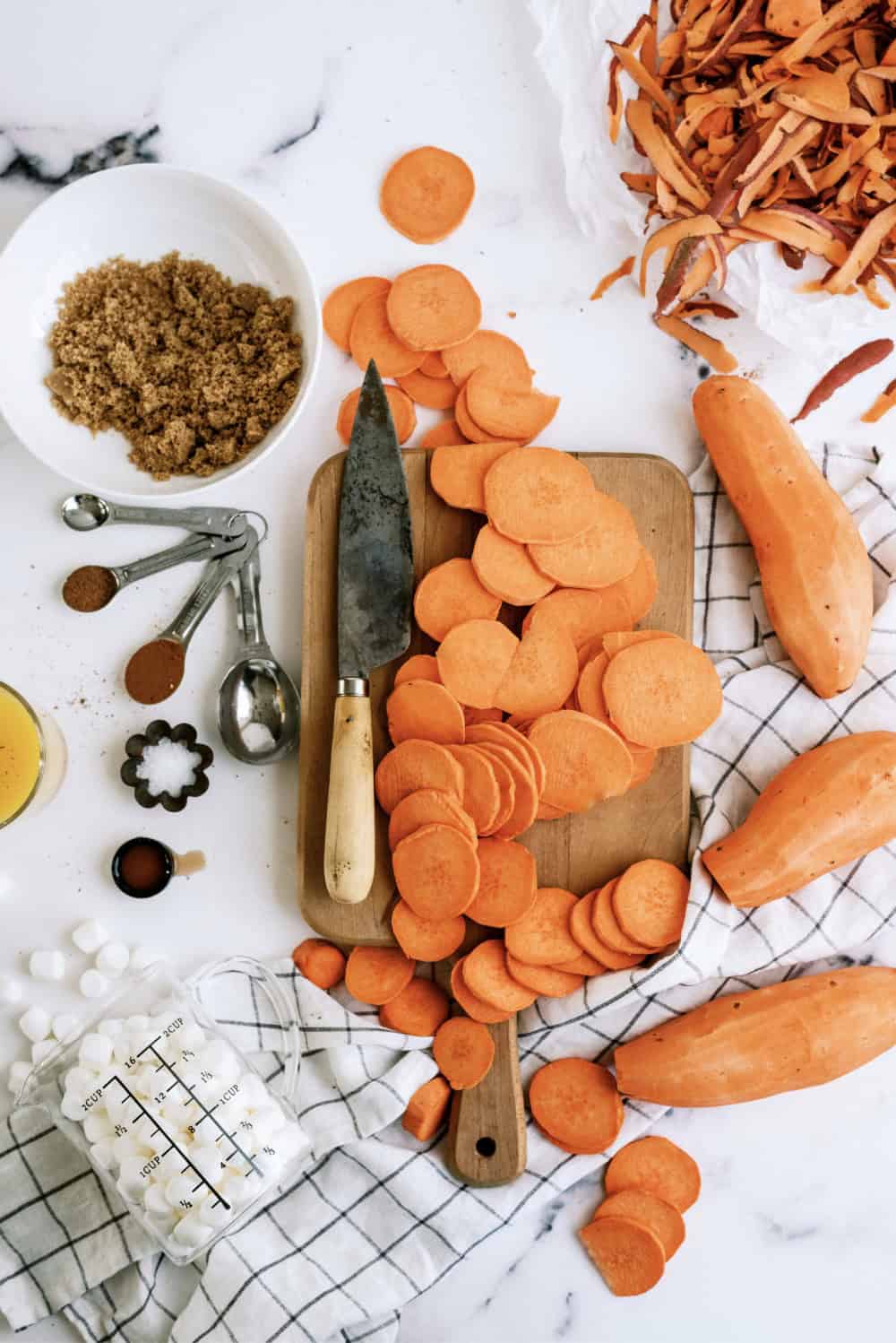 Ingredients needed for slow cooker sweet potatoes laid out on the table