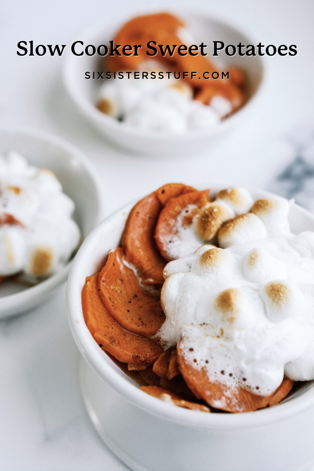 slow cooker sweet potatoes in 3 ramekins with marshmallows on top