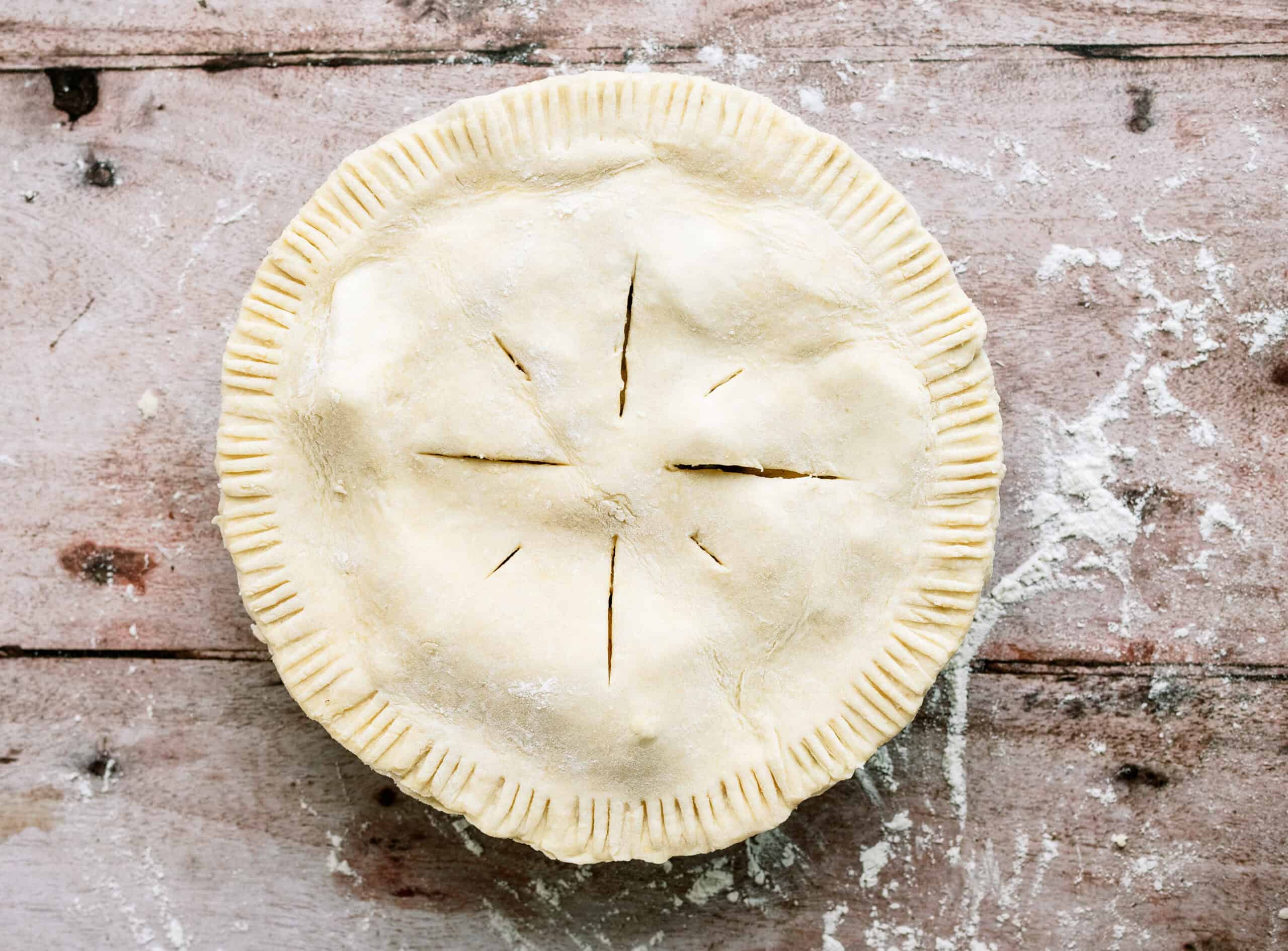 apple pie ready to be baked in the oven