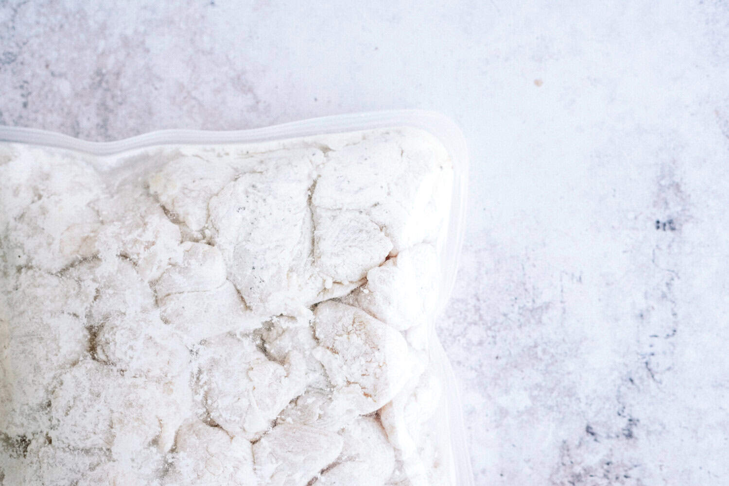 chicken in bag coated in flour