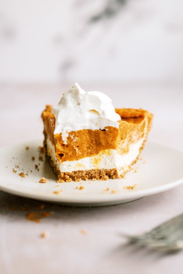 Double Layer Pumpkin Pie with bite out of it