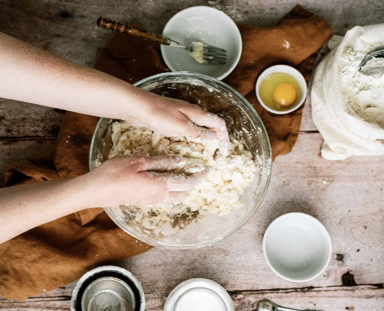 mixing pie crust dough together with your hands