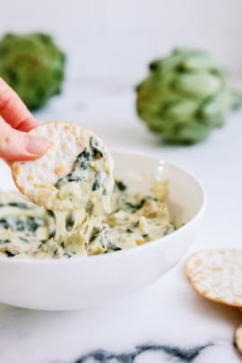 Instant Pot Spinach Artichoke Dip with dipped cracker