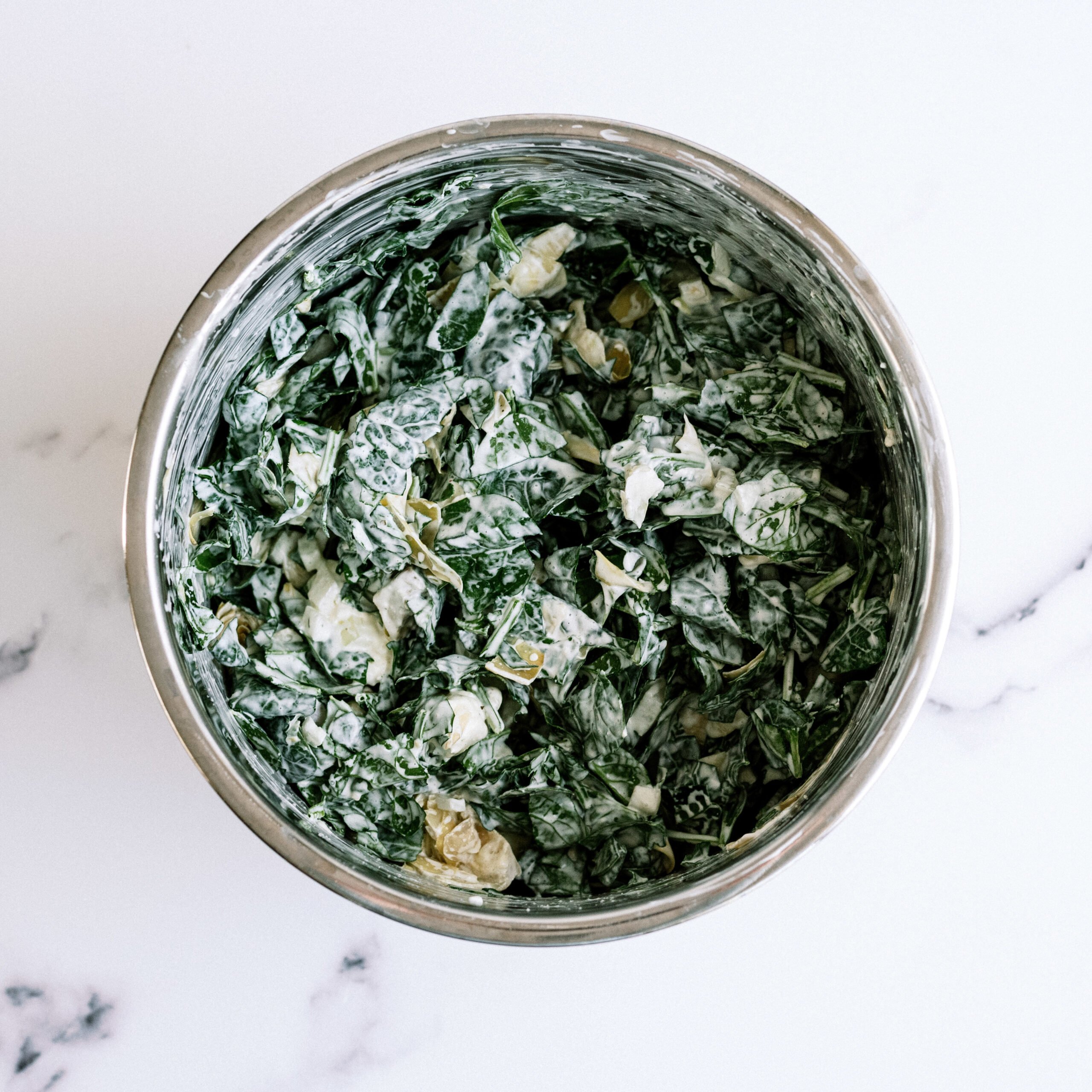 Instant Pot Spinach Artichoke dip after cooked and spinach is mixed in