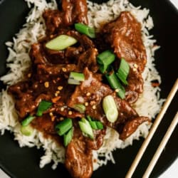 Delicious Mongolian beef served over white rice with green onions.