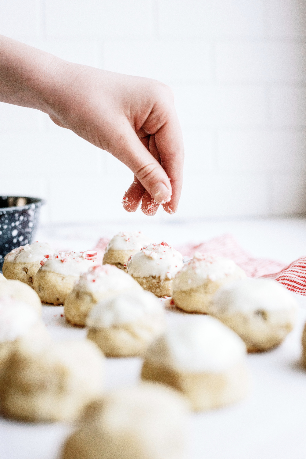 sprinkle crushed candy canes on top of cookies with white chocolate on top
