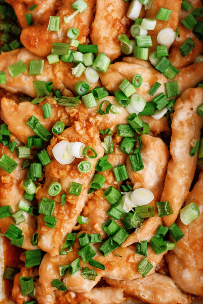 Baked chicken tenders with green onions on top