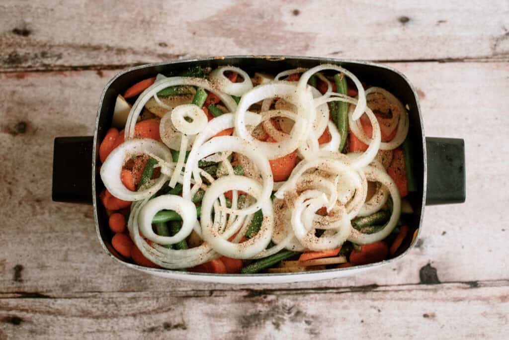 vegetables in the bottom of the slow cooker