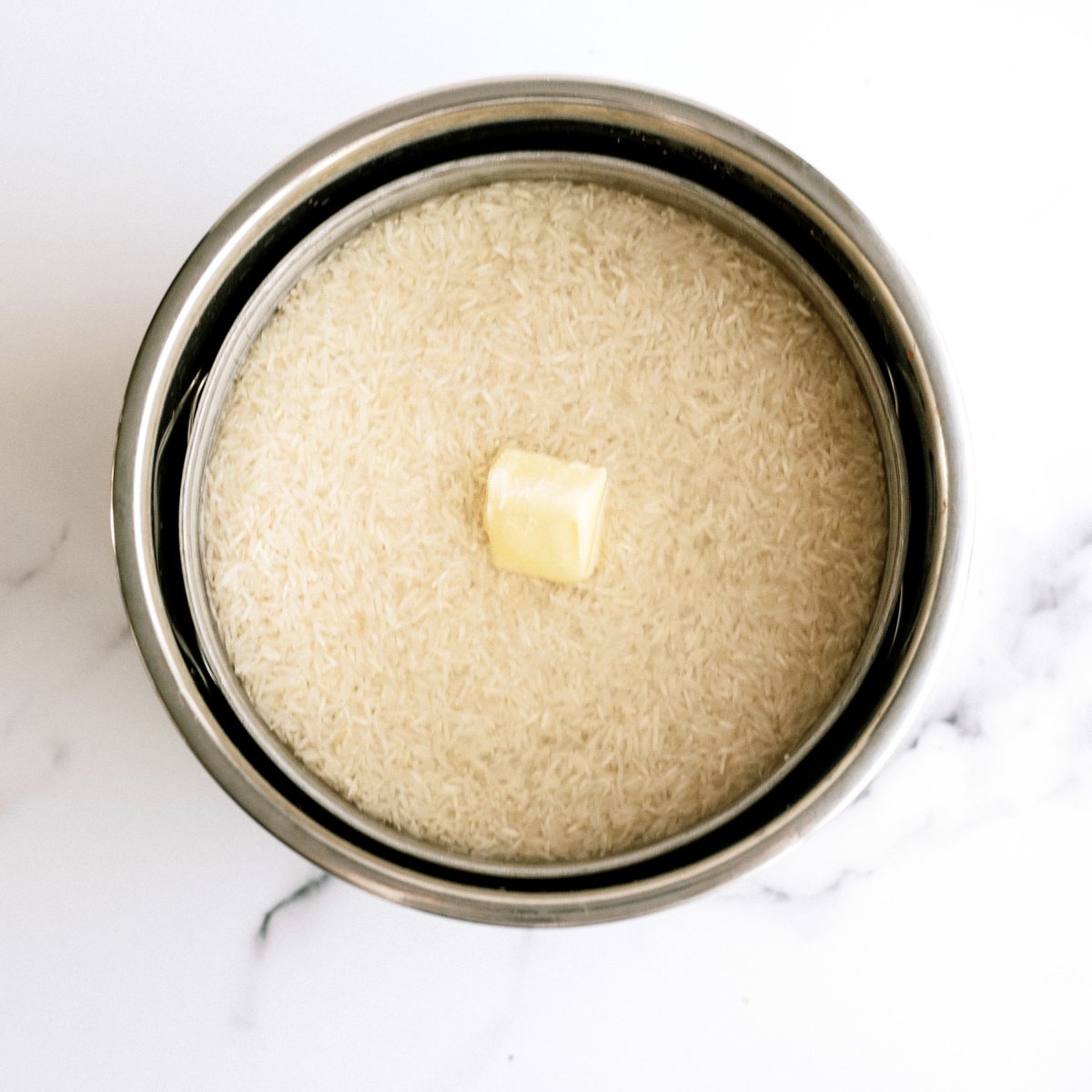 rice with butter on top to cook in the instant pot