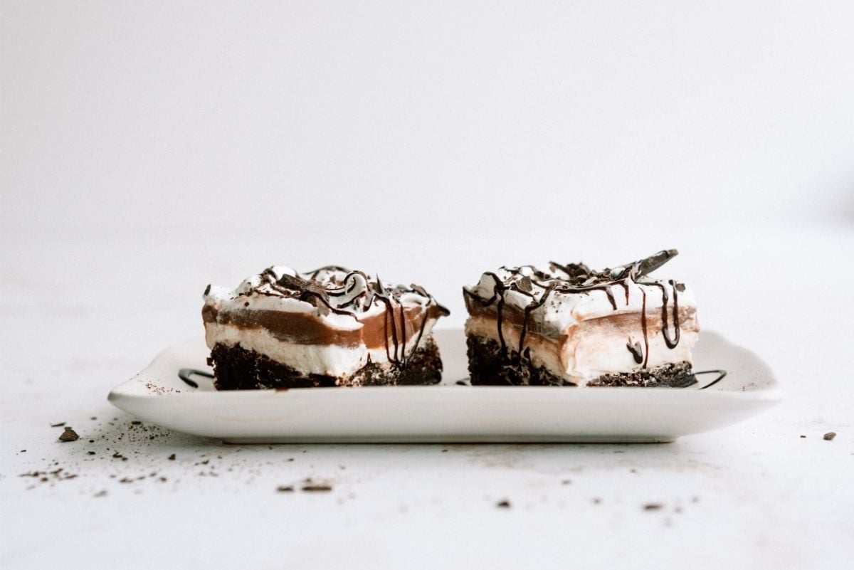 Layered Brownie Pudding Dessert slices on plate
