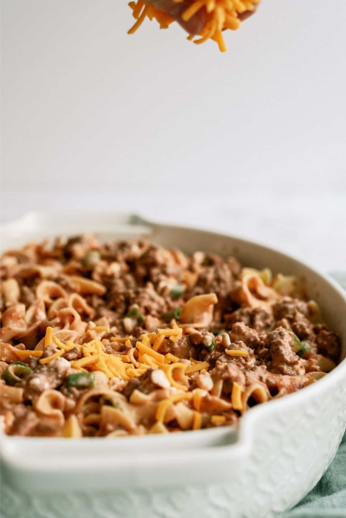 Shredded Cheese on Beef and Noodle Casserole