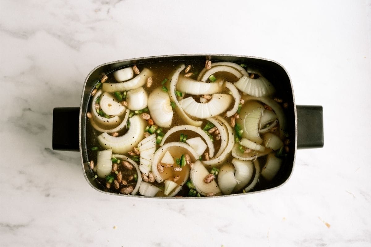 Slow Cooker Filled with Ingredients for Slow Cooker Refried Beans