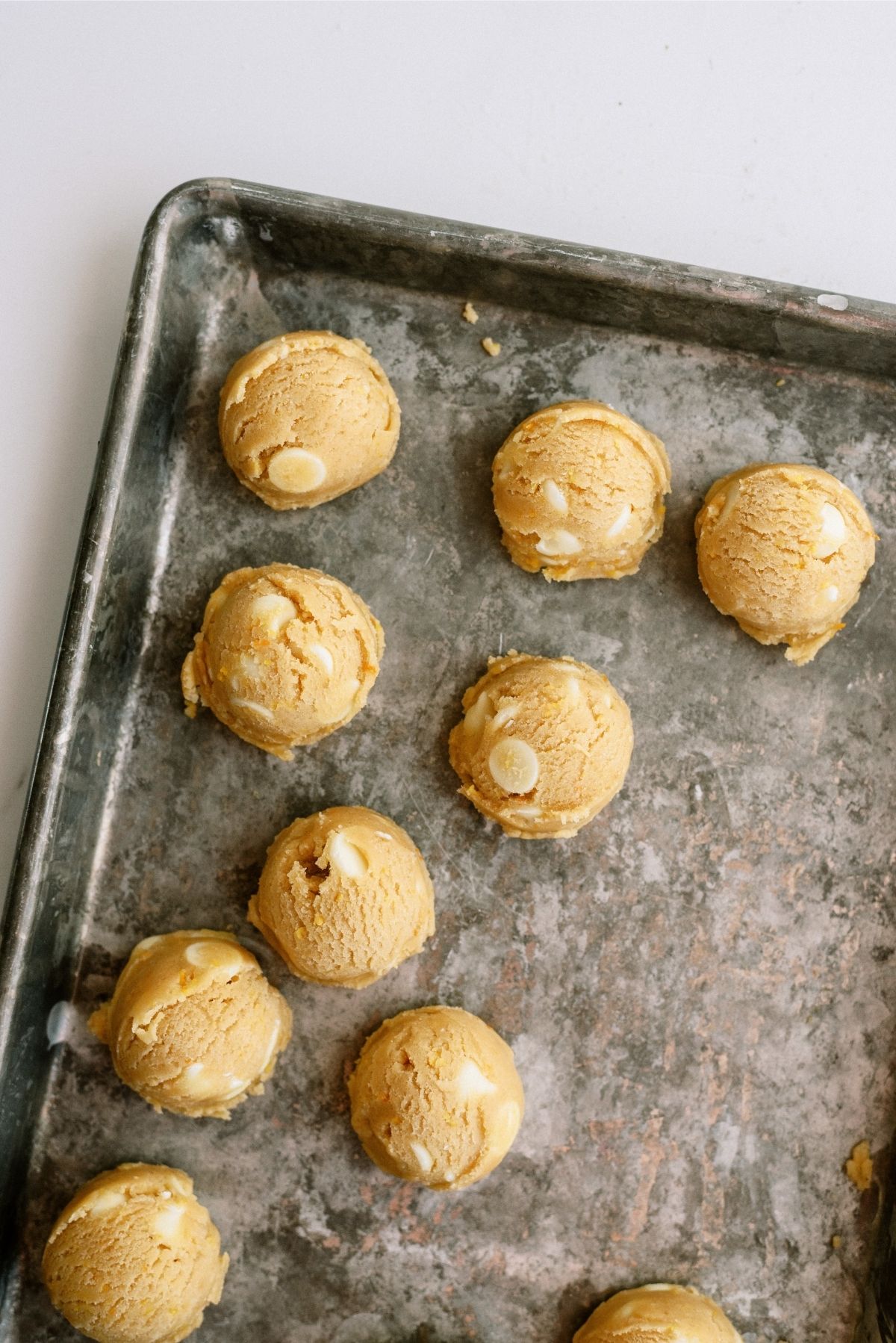 Cookie Dough balls on baking sheet for Orange Creamsicle Cookies Recipe