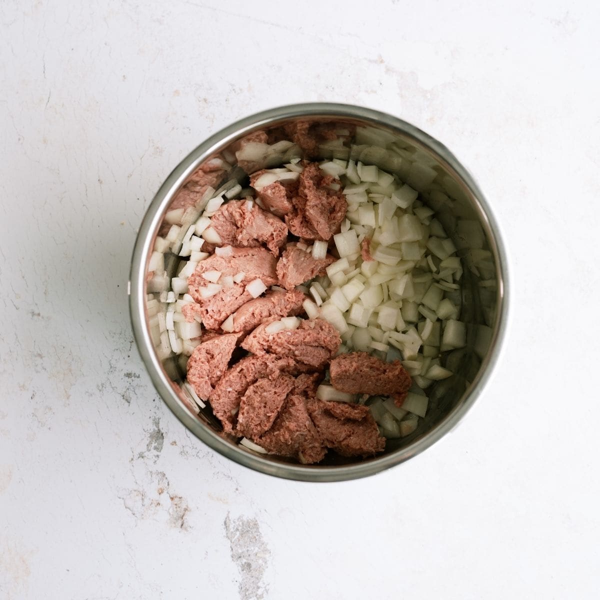 Ground turkey and onions in Instant Pot for Ground Turkey and Rice Taco Bowls Recipe