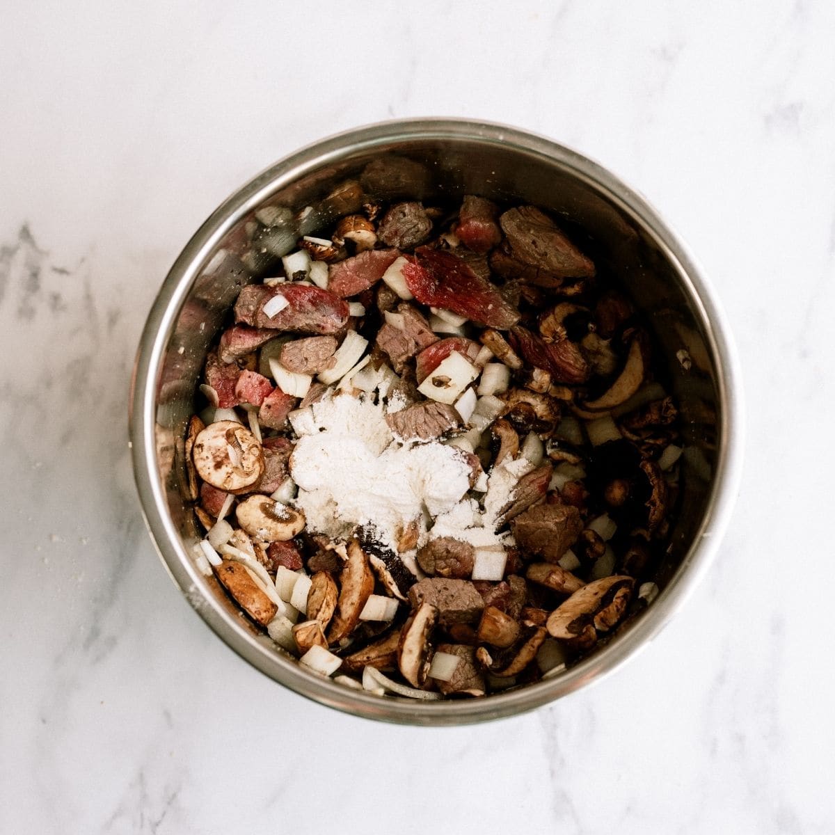 Ingredients in Instant Pot for Beef Stroganoff Recipe