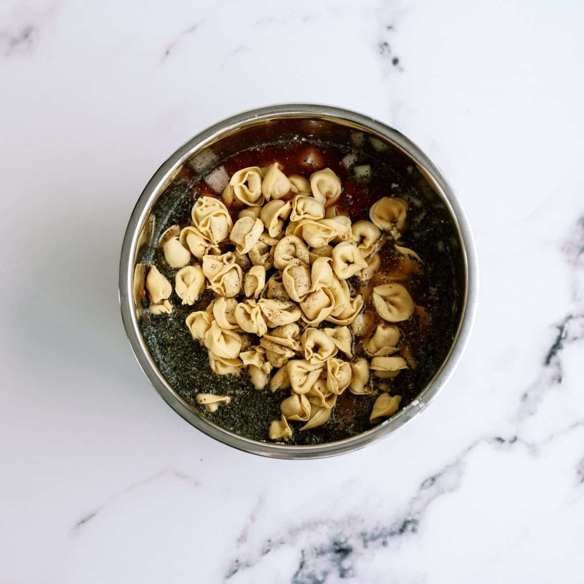 Ingredients in Instant Pot for Instant Pot Creamy Tortellini Soup