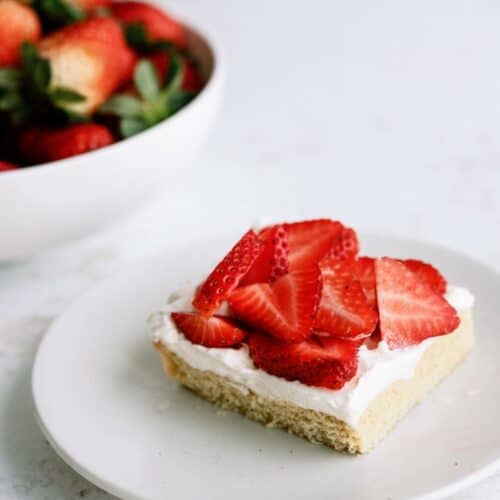 Strawberry Shortcake Bar on a plate topped with fresh strawberries.