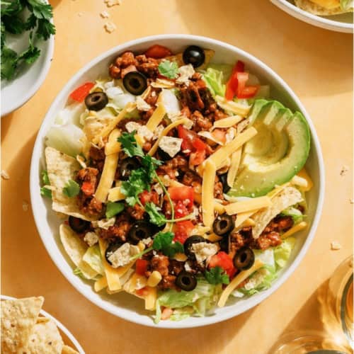 Top view of Taco Salad in a bowl with toppings.