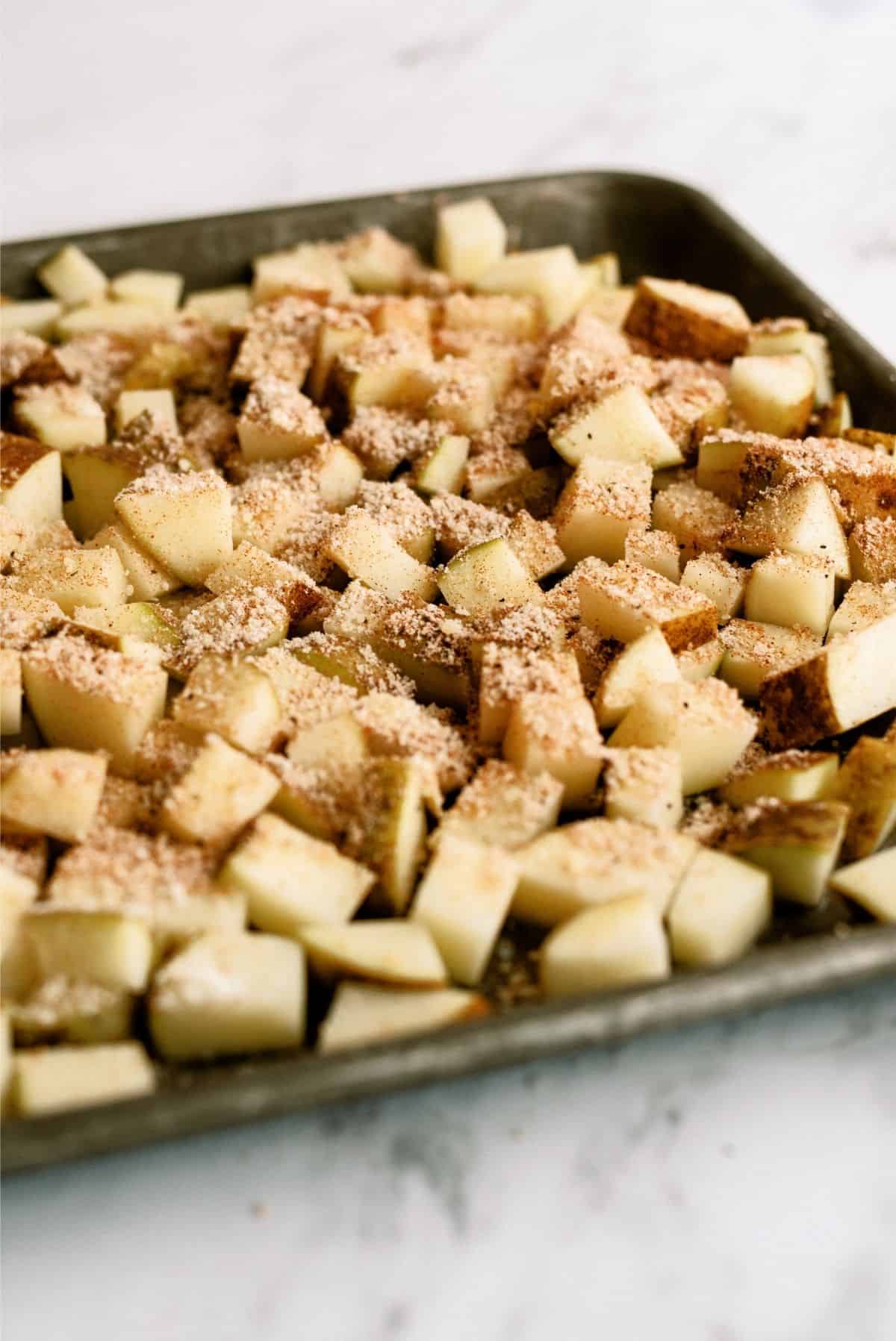 Uncooked Roasted Parmesan Potatoes on sheet pan